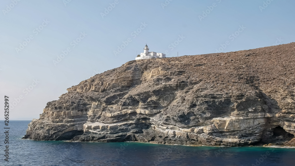 lighthouse on a greek island in the mediterranean sea