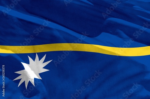 Waving Nauru flag for using as texture or background, the flag is fluttering on the wind