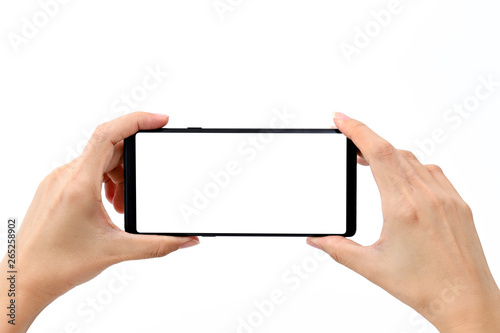 Hand holding modern smart phone with blank white screen for mockup
