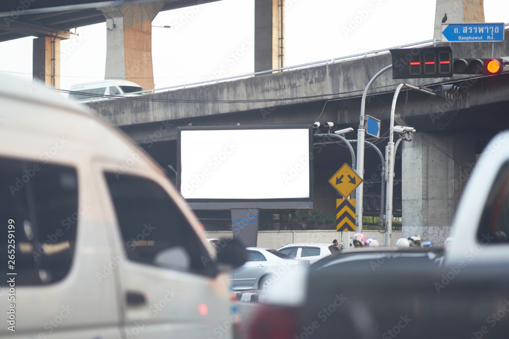 White mock up of billboard high level vision on street junction with cars foreground White mock up of billboard high level vision on street junction with cars foreground