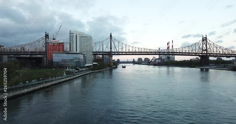 New York City, NY - April 2019: Bridge and skyline New York City, NY - April 2019: Bridge and skyline