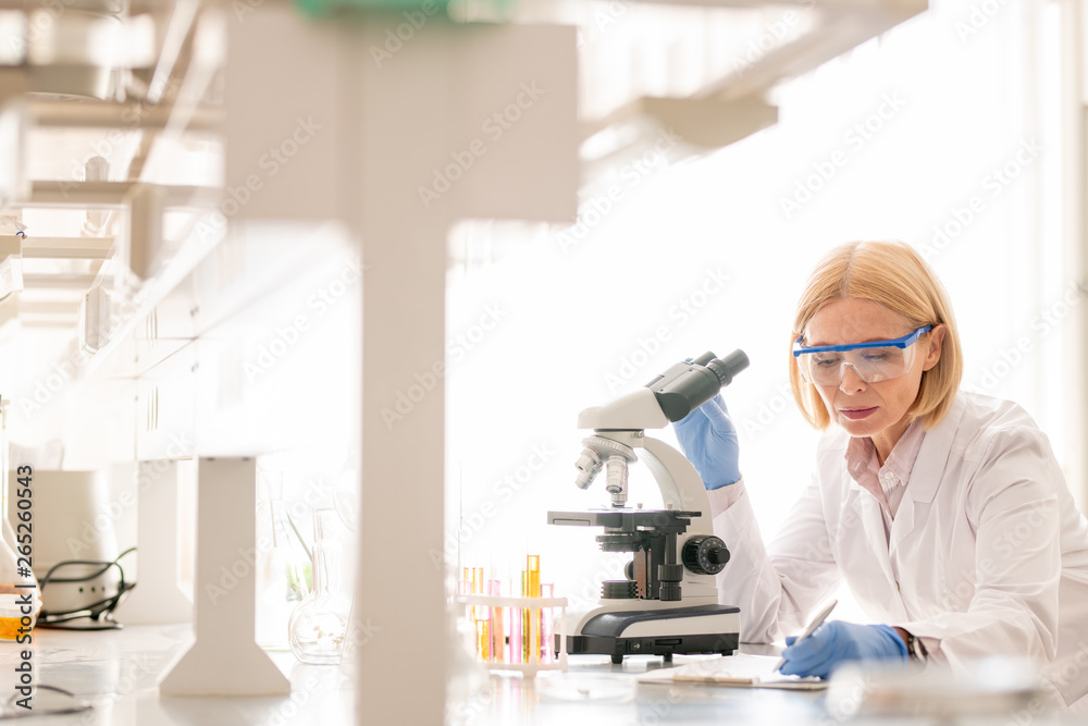 Lady busy with biological research Lady busy with biological research