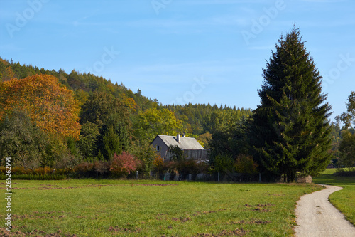 Country house. Residential building in the middle of the forest. House built outside the city. Classic German construction. German house in the village.