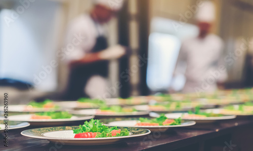 The atmosphere in the kitchen in the arrangement of food dishes.This image is soft focus.