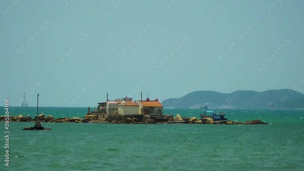 a small island with a house floating boat a small island with a house floating boat