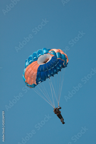 Wallpaper Mural Parachute against the blue sky in an unusual color scheme. Imitation of a two-color film process. Torontodigital.ca