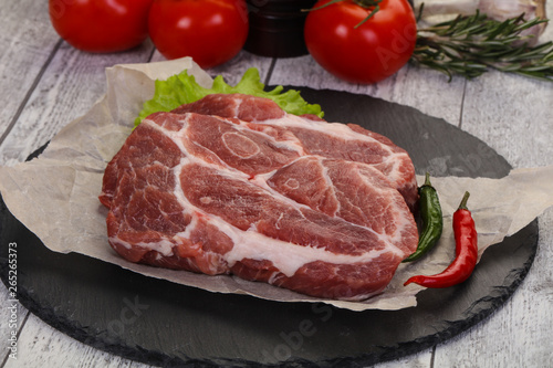 Raw pork neck steak