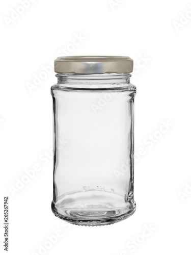 The empty glass jar closed by a metal cover on a white background