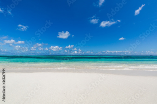 Closeup of sand on beach and blue summer sky 