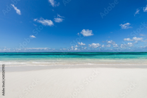 Fototapeta Naklejka Na Ścianę i Meble -  Closeup of sand on beach and blue summer sky 