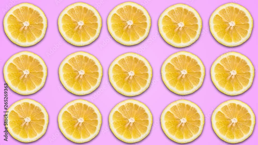 Abstract color animation of sliced lemon on violet pastel background. 4K seamless loop clip art fruit footage. Abstract color animation of sliced lemon on violet pastel background. 4K seamless loop clip art fruit footage.