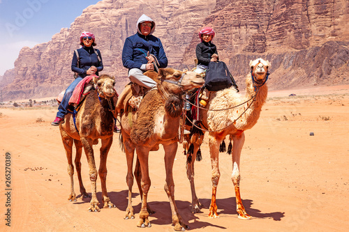 Con i cammelli nel deserto del Wadi Rum, Giordania  photo