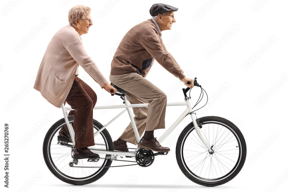 Naklejka premium Senior man and woman riding a tandem bicycle