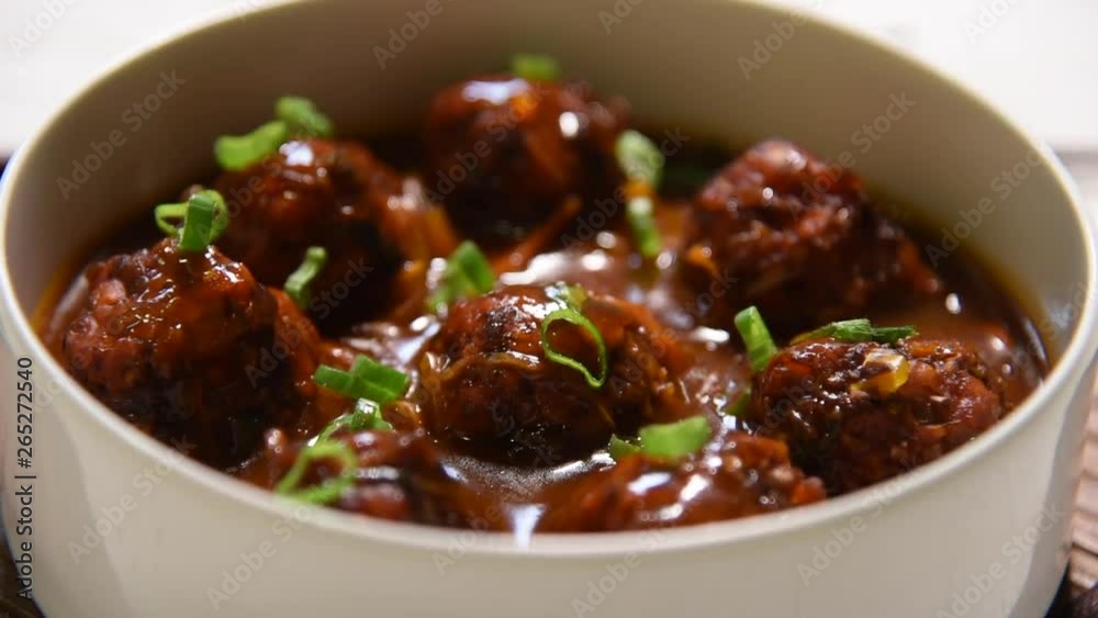 Manchurian balls with gravy - Popular food of India made of cauliflower florets or chicken Manchurian balls with gravy - Popular food of India made of cauliflower florets or chicken