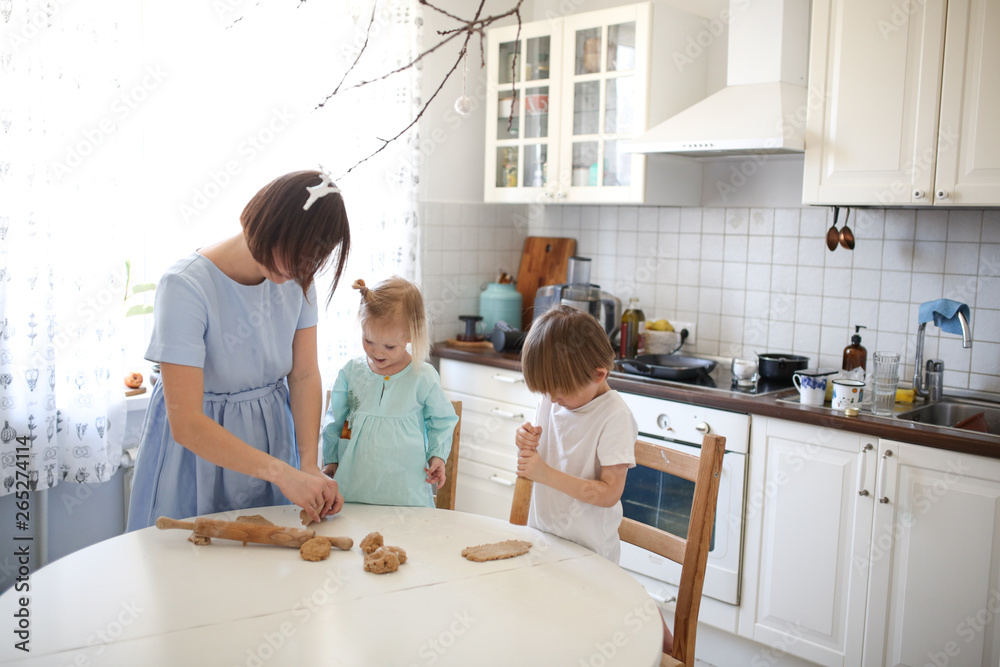 Children brother and sister make cakes from dough Children brother and sister make cakes from dough