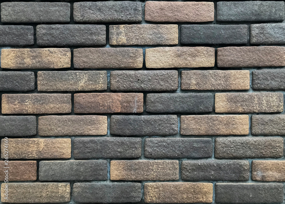 dirty old random dark color brick wall texture for any design background.