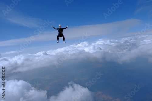 Girl in leather jacket is flying in the amazing sky. © Sky Antonio