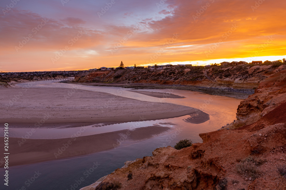 A beautiful sunrise at southport port noarlunga south australia overlooking the wooden staircase ocean and cliffs on the 30th April 2019