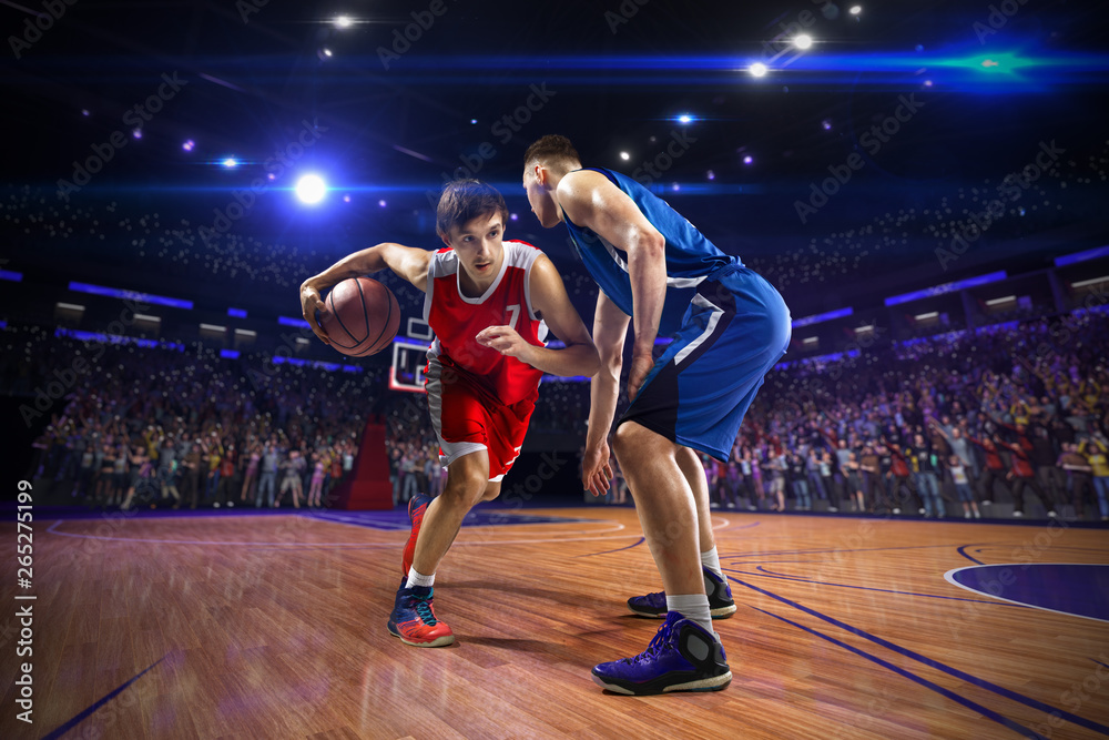 Basketball player n action. around Arena with blue light spot Basketball player n action. around Arena with blue light spot