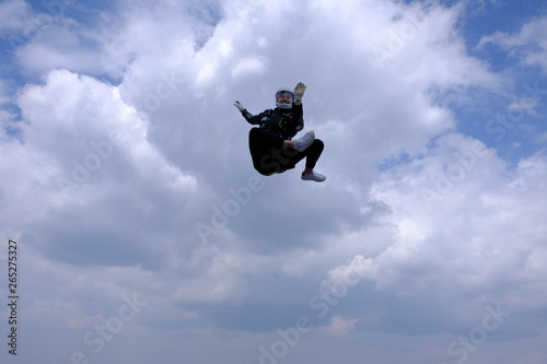 Girl in leather jacket is flying in the amazing sky. © Sky Antonio