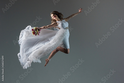 Girl in a wedding dress in flight