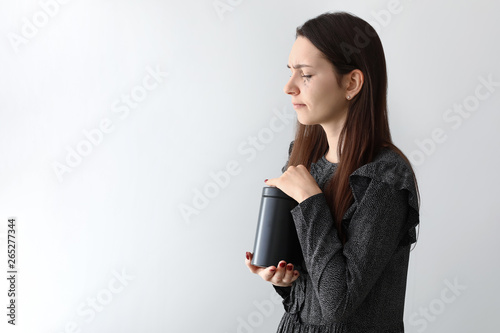Crying with mortuary urn on...