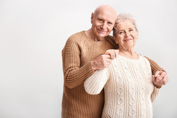 Portrait of senior couple on white background