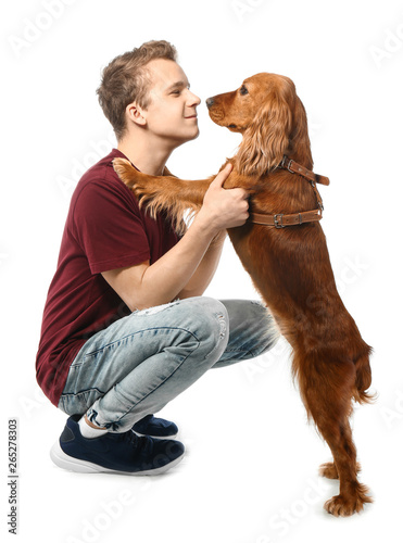 Teenage boy with cute dog o...