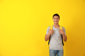African-American teenage boy on color background