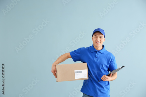 Delivery man with box on co...