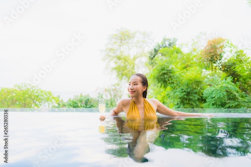 Portrait beautiful young asian woman with champagne glass for relax leisure