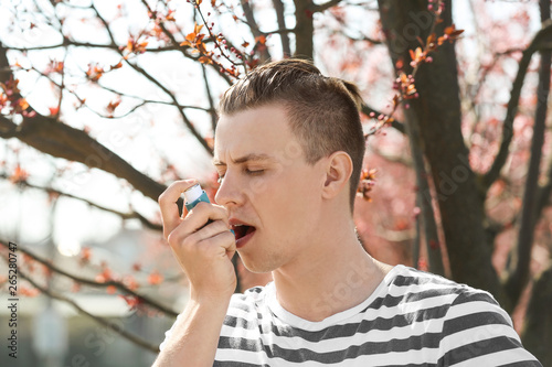 Man with inhaler having ast...