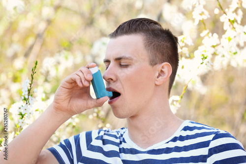 Man with inhaler having ast...