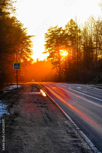 Country road at a spring at sunset in Moscow region