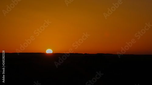 Sunrise at sandstone formation in the Sahara desert near Yoa Lake group of Ounianga Kebir, Ennedi, Chad photo