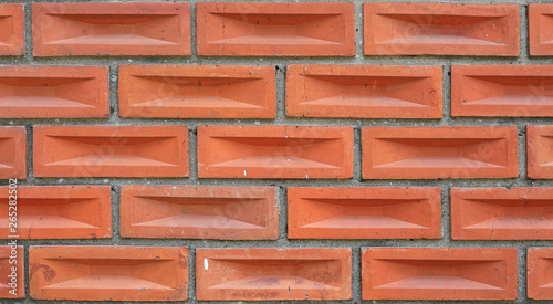 square brown brick tile background.