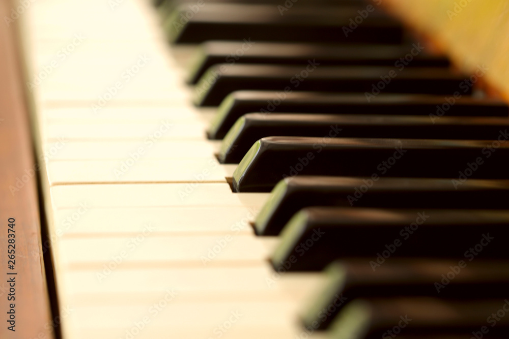 Piano keys. Background, blur, close-up, cropped shot, side view, macro. Concept of art and hobby. Piano keys. Background, blur, close-up, cropped shot, side view, macro. Concept of art and hobby.
