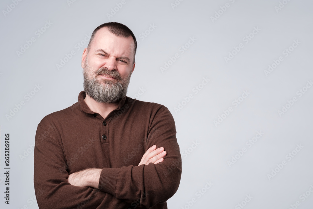 Angry, pissed off mature man with arms crossed folded. - obrazy, fototapety, plakaty 