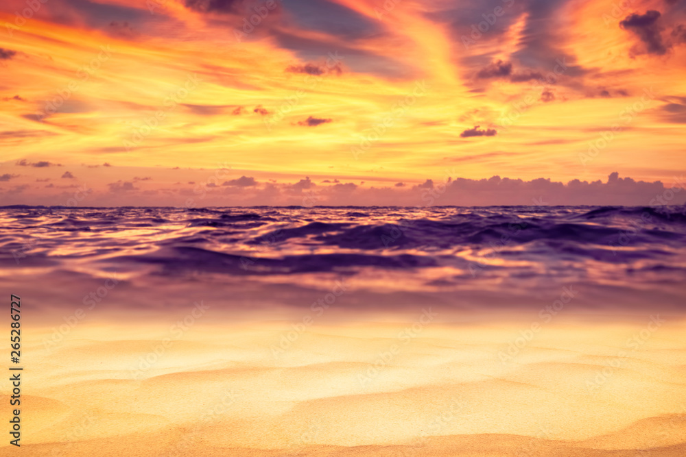 Tropical beach with sunset sky and cloud background.