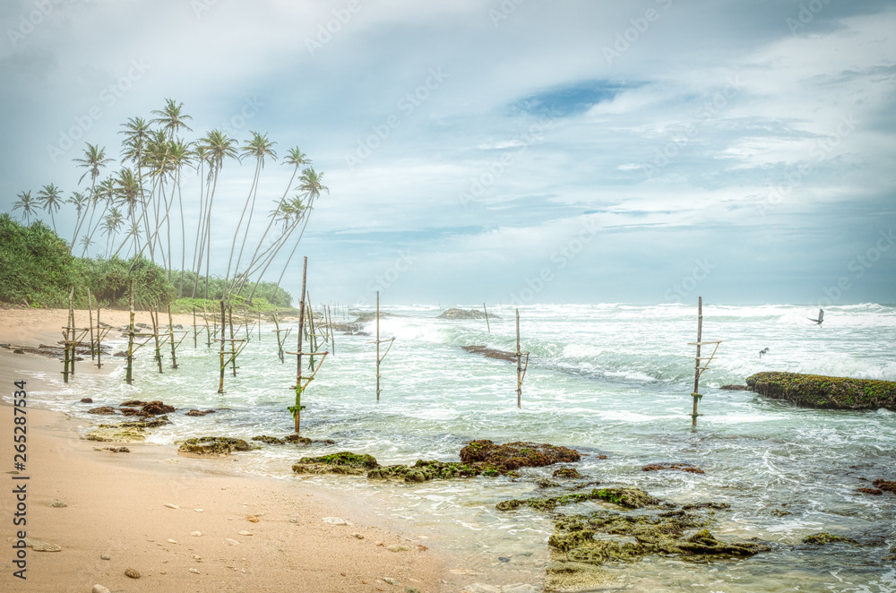 Sri Lanka stilts fishermen sticks in a windy day