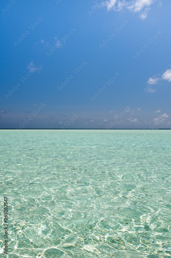 Vertical view of the sea horizon with turquoise waters in Maldives