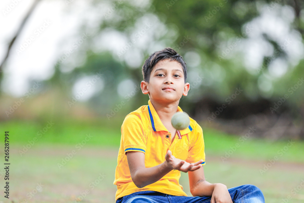 Rural Indian Child Playing Cricket Rural Indian Child Playing Cricket