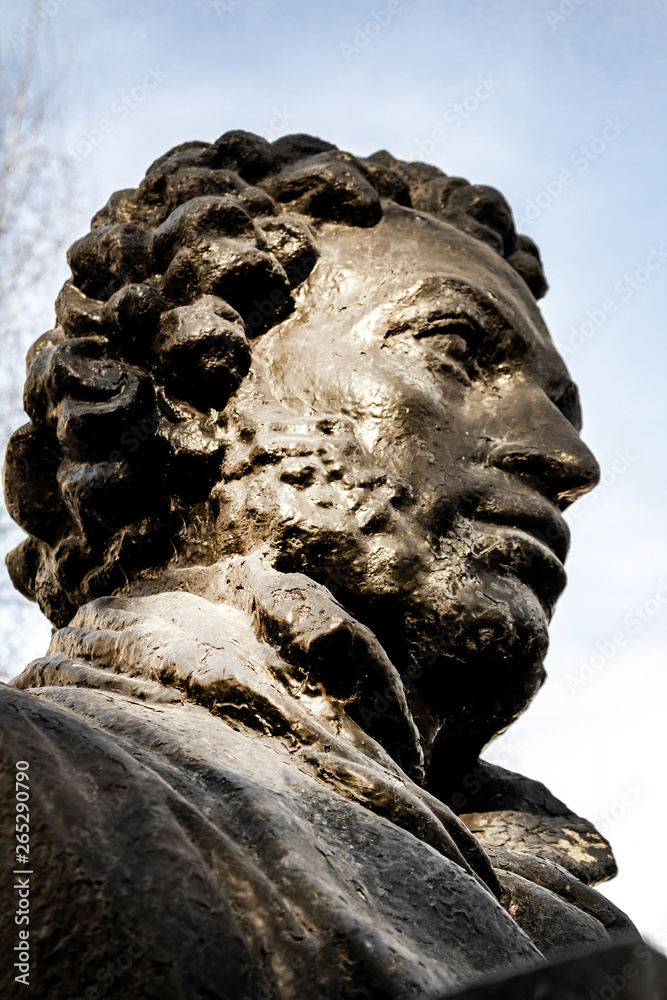 UFA, RUSSIA - 11 APRIL 2019: close-up bust of the Alexandr Sergeevich Pushkin in the sun, greatest russian poet on Pushkin street