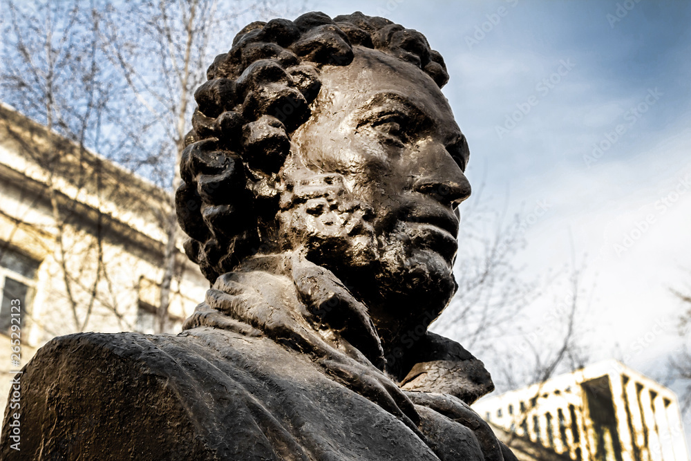 Fototapeta premium UFA, RUSSIA - 11 APRIL 2019: close-up bust of the Alexandr Sergeevich Pushkin against the sky, greatest russian poet
