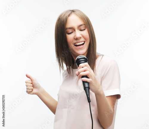 beautiful stylish woman singing karaoke 