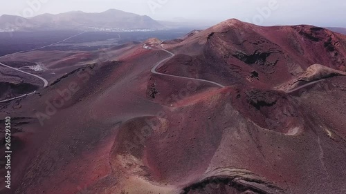 red volcanic mountains with craters  in Timanfaya national park in Lanzarote island, aerial view landscape of Canary islans, nature in Spain photo
