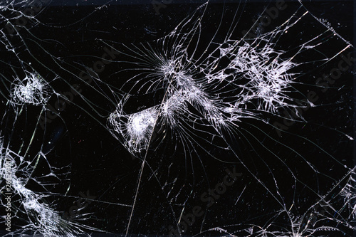 Broken and racked glass screen smartphone , white lines on black background, design element, backdrop texture