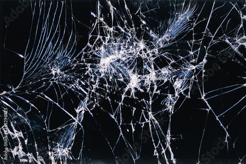 Broken and racked glass screen smartphone , white lines on black background, design element, backdrop texture