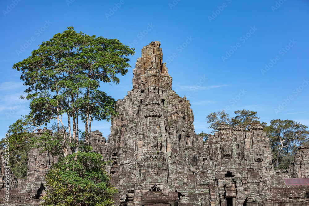 Beautiful face sculptures at teh famous Bayon temple in the Angkor Thom temple complex, Siem Reap, Cambodia