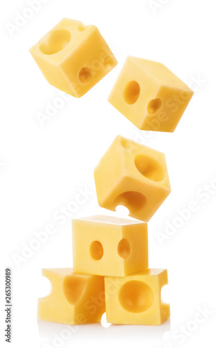 Falling cubic pieces of delicious cheese, isolated on white background